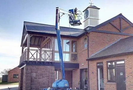 cleaning a building in Southport with cherry picker