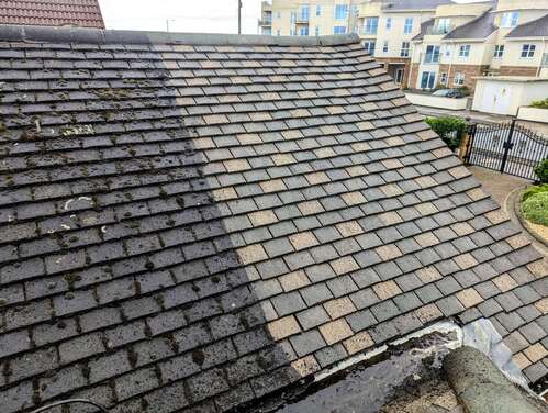 removing moss buildup from roof in Manchester